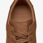 Brown sneakers with stripes